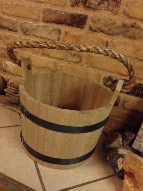 shows a hand made wooden bucket of oak